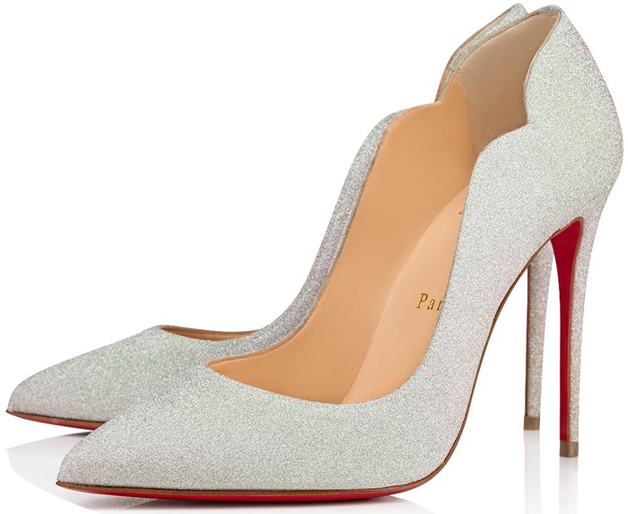 Christian Louboutin's Hot Chick pumps in glittering silver with the iconic red sole, featuring a bold arch and scalloped topline