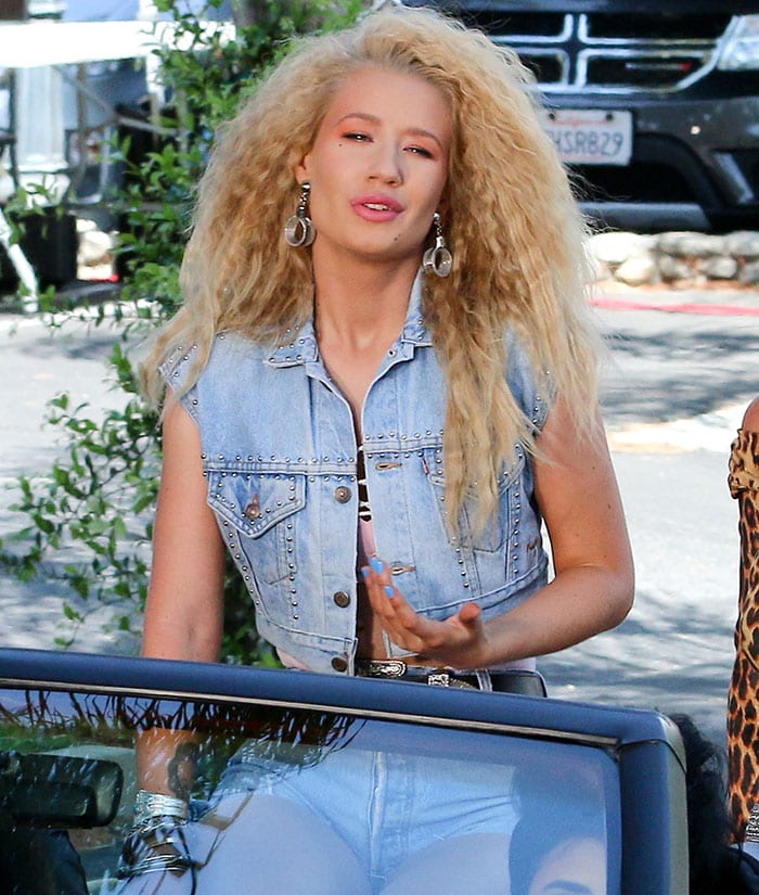Iggy Azalea in a midriff-baring pink monokini