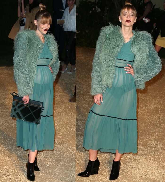 Jaime King showcases her full Burberry look—sheer dress, textured coat, green clutch, and glossy black booties—while posing on the event carpet
