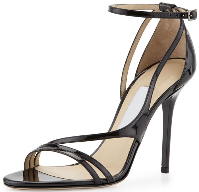 The slender straps of this Jimmy Choo sandal flatter cocktail dresses in high-gloss patent leather.