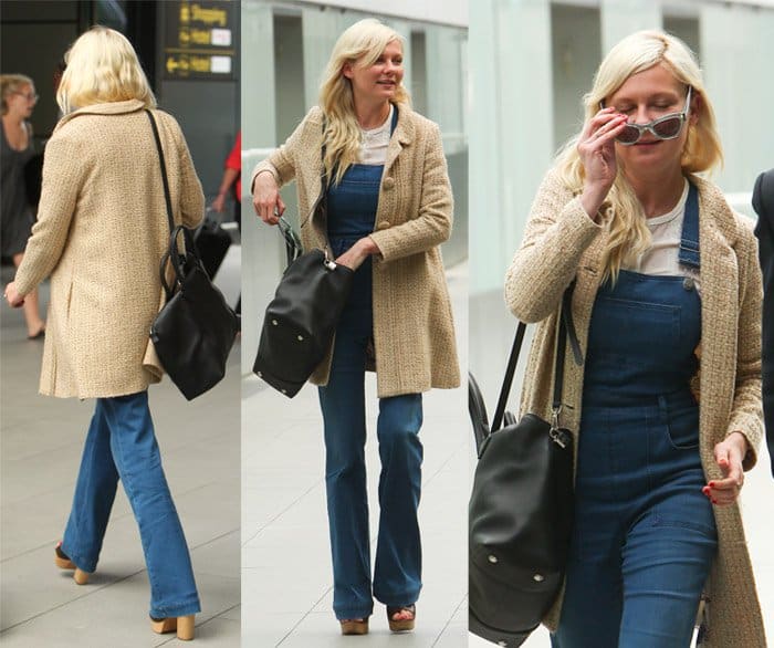 Kirsten Dunst in denim dungarees at London airport, August 2014