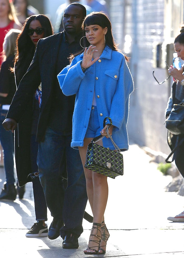 Recreate Rihanna’s effortlessly bold look with an oversized blue coat, strappy lace-up heels, and a statement quilted handbag for a chic and daring vibe