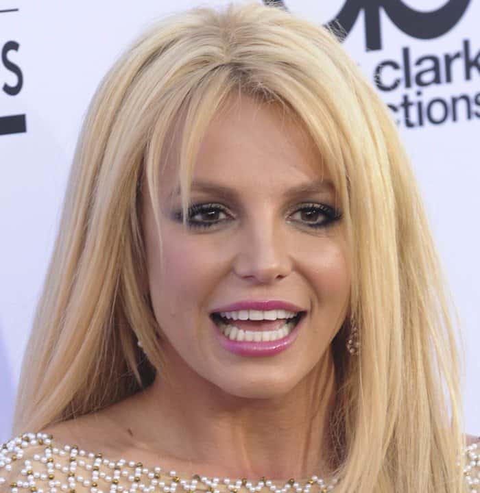 Britney Spears paired smoky eye makeup, glossy pink lips, and long blonde layers with her crystal-embellished gown