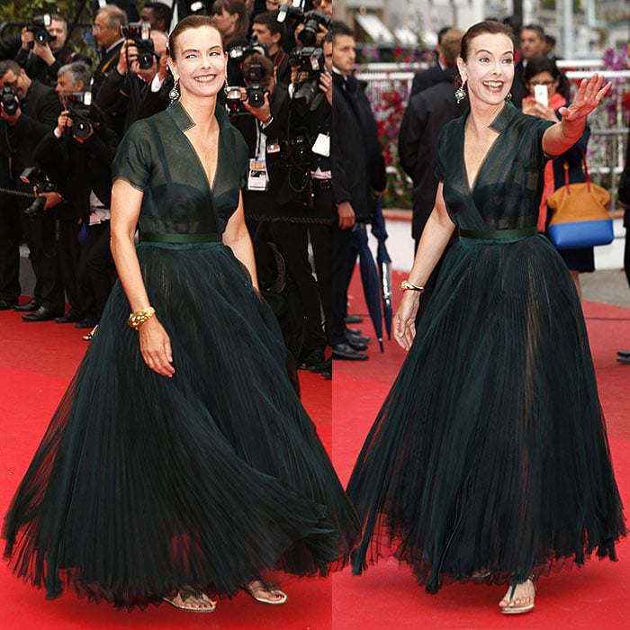 Carole Bouquet embodied effortless French elegance at Cannes, grounding her dramatic tulle gown with refined T-strap flat sandals on the red carpet