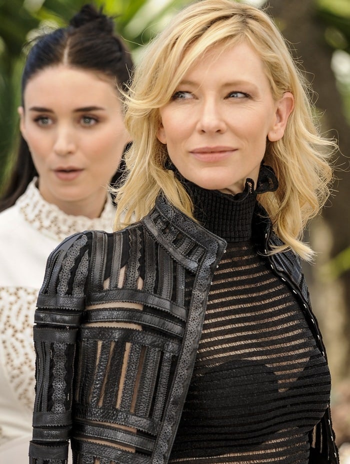 Cate Blanchett exuded dark romanticism in a black Alexander McQueen Fall 2015 sheer dress and jacket, radiating modern femininity beside Rooney Mara in ivory lace