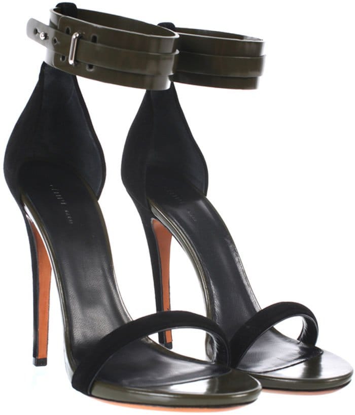 Céline’s “Mulese” sandals balance sleek minimalism with edge, featuring a slim suede toe strap, a razor-sharp stiletto heel, and a bold double ankle cuff in glossy leather