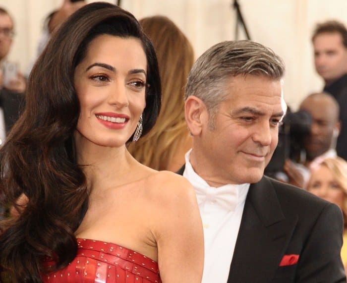 Amal Clooney's dress was a perfect blend of intricate embellishments, hand-painted pailettes and tiers of alternating red fabric that complemented her impeccable sense of style