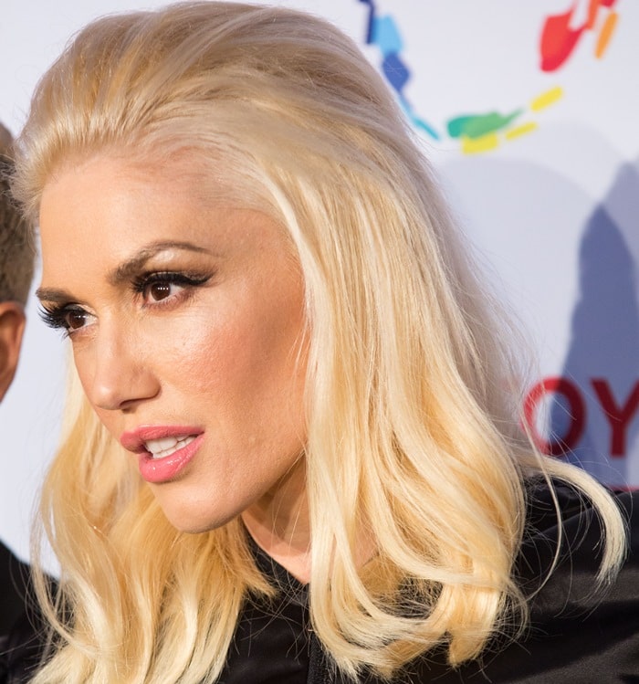 Gwen Stefani radiates classic glamour with her voluminous blonde waves and signature bold lashes