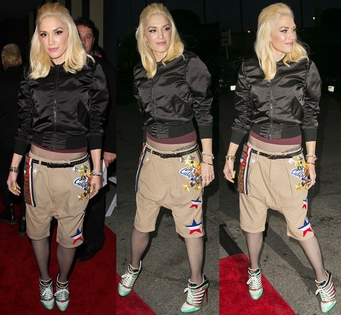 Gwen Stefani shows off her eclectic style, combining a cropped bomber jacket with embellished shorts, fishnet tights, and platform sneakers