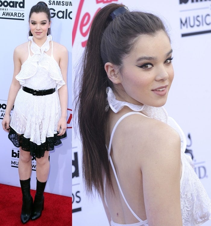 Hailee Steinfeld stuns in a ruffled white halter dress paired with black boots and a high ponytail at the 2015 Billboard Music Awards