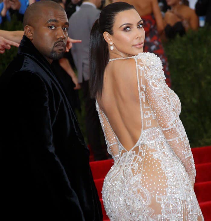 At the Met Gala 2015, Kim Kardashian West wore a custom-made nude silk tulle gown designed by Peter Dundas for Roberto Cavalli