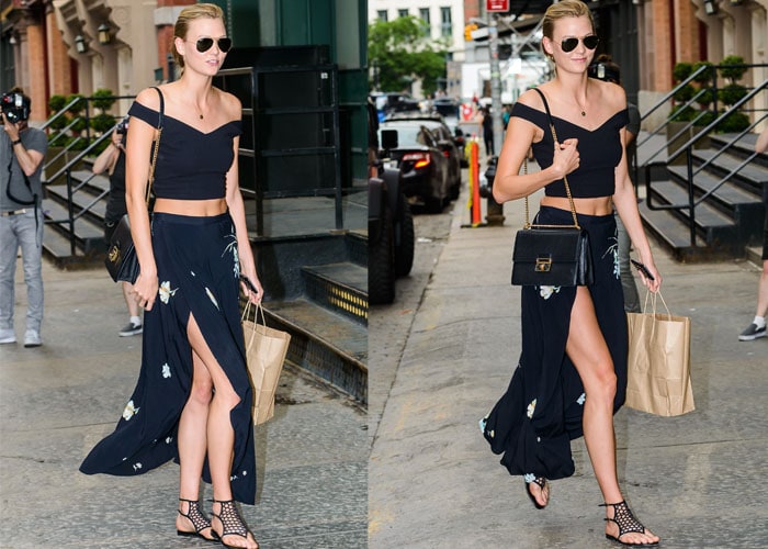 Karlie Kloss steps out in a breezy off-shoulder crop top and high-slit floral skirt, pairing the look with Tamara Mellon cutout sandals for effortless summer chic