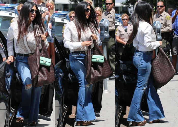 Kourtney Kardashian carried a Fendi Baguette micro leather shoulder bag