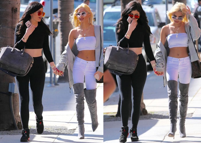 Pia Mia shows off her signature bold style in a white bandeau top and high-waisted jeans tucked into gray suede over-the-knee stiletto boots, adding a light gray coat and oversized white sunglasses for a confident street-glam finish