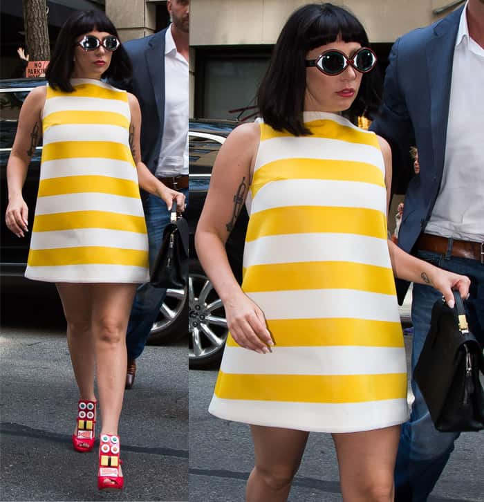 Lady Gaga steps out in a bold yellow and white striped shift dress, paired with quirky sushi-adorned platform shoes and round sunglasses