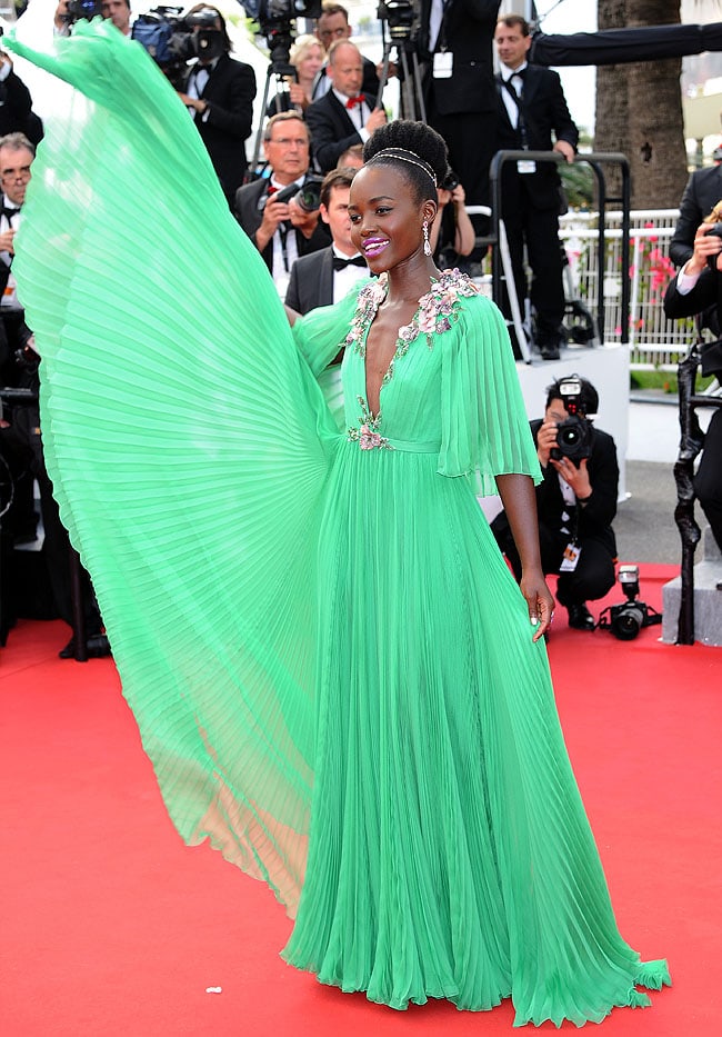 Lupita Nyong'o creating a dramatic picture for the photographers