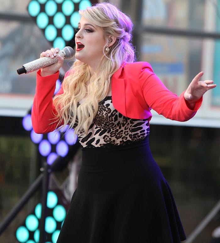 Meghan Trainor's blonde locks were worn in a half-up, half-down style, with loose curls flowing over her shoulders