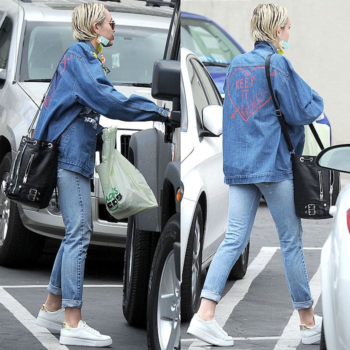 Miley Cyrus '90s-themed double-denim ensemble, complete with a denim jacket that has "Keep It Bright" scribbled on the back