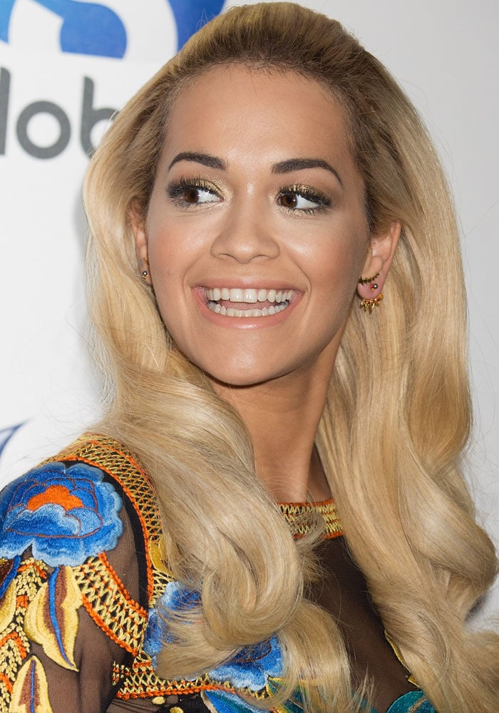 Rita Ora debuts voluminous, waist-length blonde waves that added glamour to her embroidered Temperley London gown