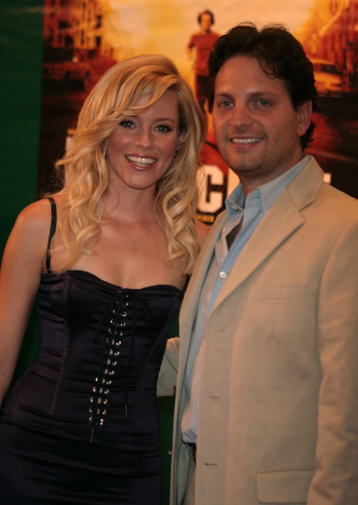 Elizabeth Banks stuns in a form-fitting corset dress while posing with her husband, Max Handelman, at the premiere of Invincible held at The Ziegfeld Theater in New York City on August 23, 2006