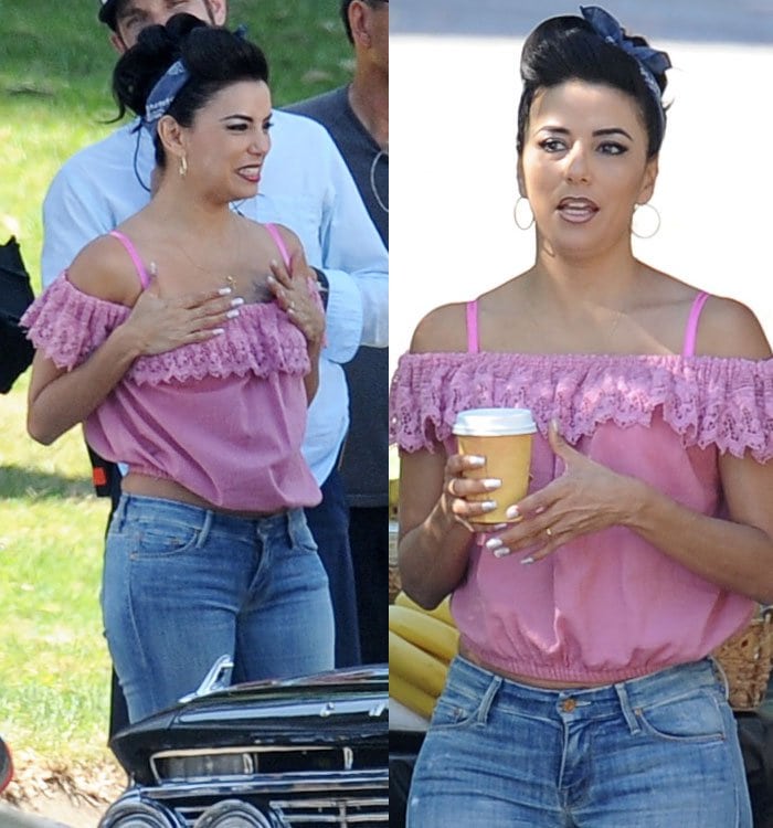 Eva Longoria channels retro charm in a pink off-the-shoulder lace top, cuffed jeans, and a vintage ’50s pin-up hairstyle finished with a headscarf