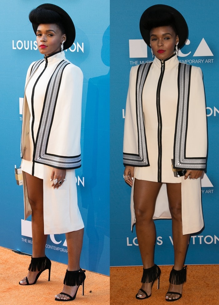 Monáe commands the orange carpet in an embroidered Sass Bide cape dress styled with a sleek black hat, stacked rings, and fringe-detailed Stuart Weitzman heels