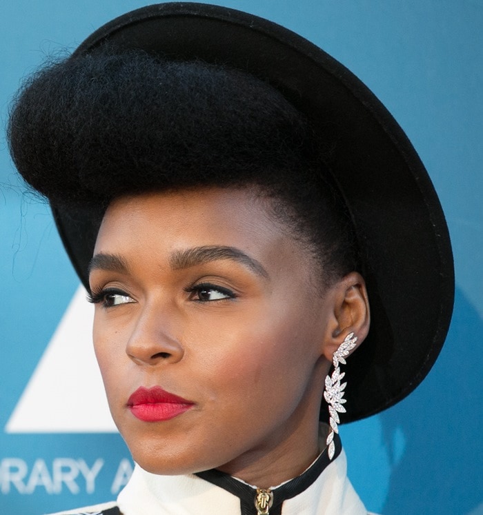 Janelle Monáe elevates her signature monochrome aesthetic with bold red lipstick, sculptural hair, and sparkling AS29 “Bamboo” earrings