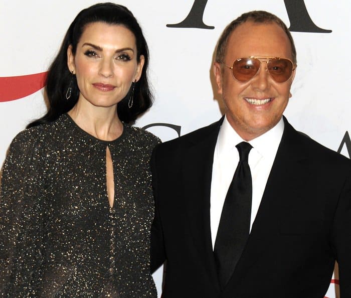 Julianna Margulies poses with Michael Kors at the 2015 CFDA Fashion Awards, wearing a shimmering long-sleeve gown from his Fall 2015 collection that balanced glamour with understated elegance in New York City