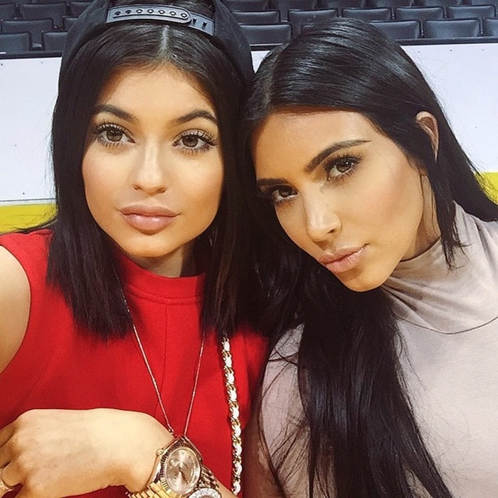 Shared on June 9, 2015, Kylie Jenner and Kim Kardashian posed courtside in coordinated looks, their matching dark hair and neutral glam highlighting just how strikingly alike the sisters appeared
