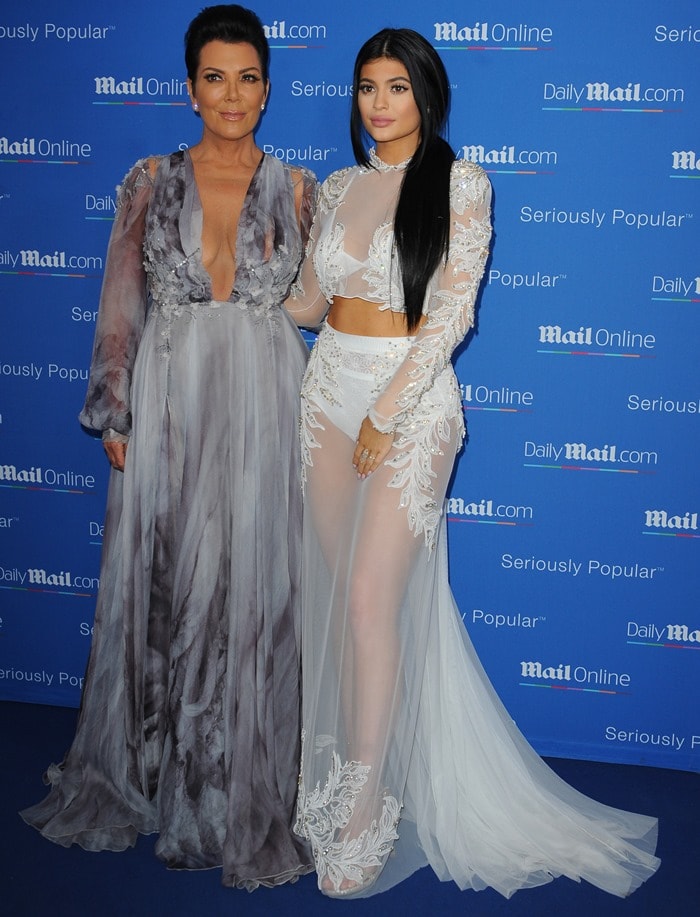 Kylie Jenner and Kris Jenner showcased their unique styles at the Cannes Lions Festival, with Kylie in a sheer, embroidered white ensemble and Kris in a flowing, low-plunging dove-grey maxi dress