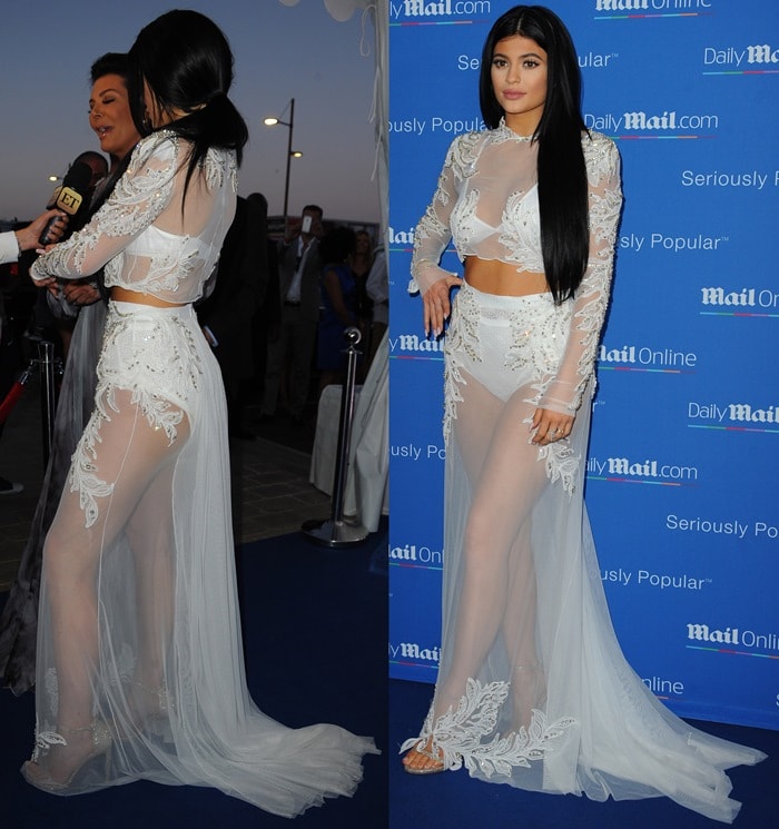 Kylie Jenner turned heads at MailOnline’s Cannes yacht party on June 24, 2015, wearing a sheer, embellished Francesco Scognamiglio Spring 2015 ensemble paired with glittering gold Stuart Weitzman “Nudist” sandals that revealed her snowy-white underpinnings
