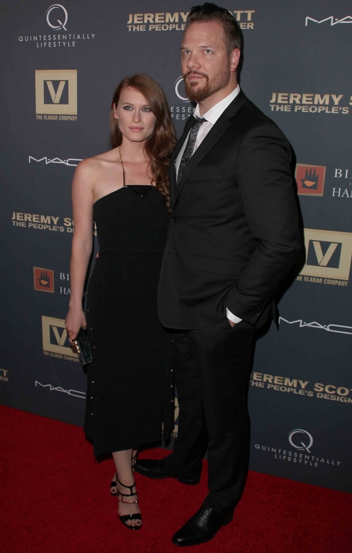 Leven Rambin steps out with Jim Parrack in a black midi dress and her repeat-wear Ruthie Davis sandals at the Jeremy Scott: The People’s Designer premiere