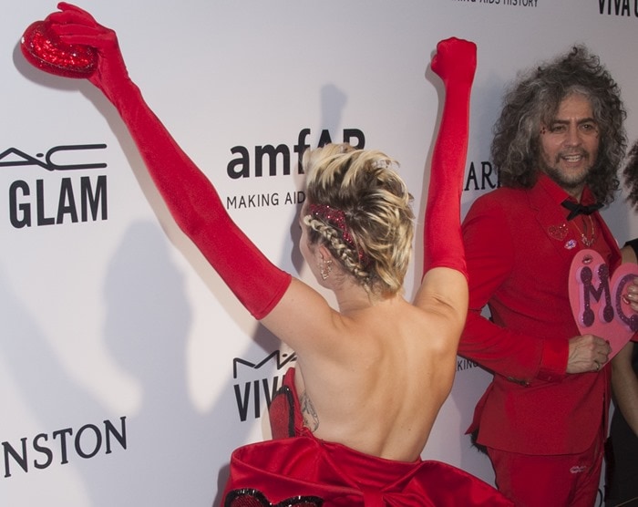 Miley Cyrus styled her blonde hair in bold braids with shimmery glitter