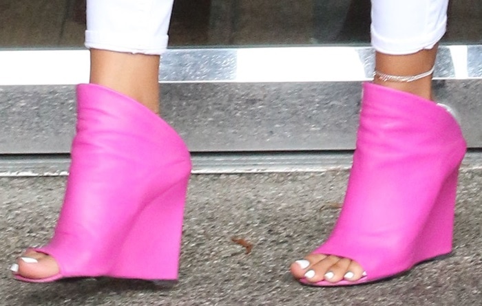 Karrueche Tran shows off her sexy toes in bright pink Balenciaga wedge mules