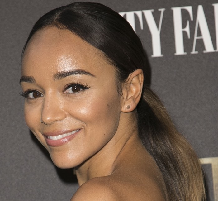 Ashley Madekwe glows on the red carpet with sleek makeup and a polished low ponytail at Vanity Fair’s TUT celebration