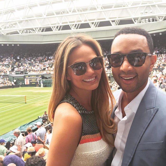 Chrissy Teigen and John Legend soak up the atmosphere at Wimbledon as they prepare to watch Serena and Venus Williams face off in one of tennis’s most iconic sibling rivalries
