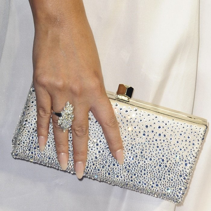 Chrissy Teigen's sparkling glittery champagne tone leather Celeste clutch