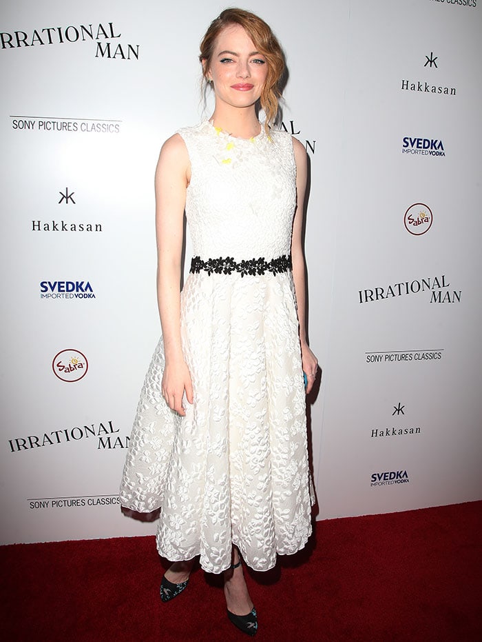 The soft texture of Emma Stone’s white floral gown was balanced by a black embroidered waistband and sharply printed ankle-strap pumps