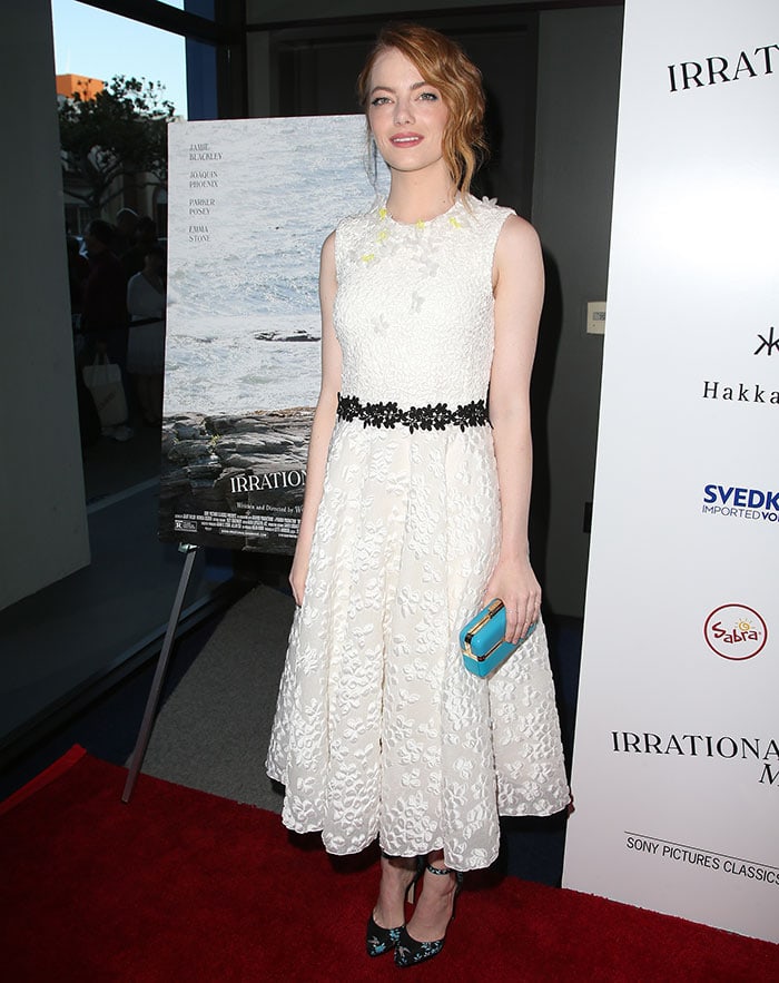Emma Stone paired her embroidered Giambattista Valli dress with floral Paul Andrew heels and a turquoise clutch at the Irrational Man premiere in Los Angeles