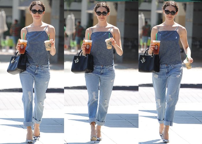Emmy Rossum kept it effortlessly chic in a chambray tank, cuffed boyfriend jeans, and black-and-white Carolina Herrera floral pumps that added a polished, feminine touch