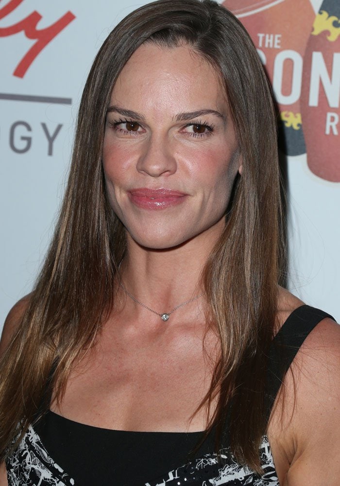 Hilary Swank wore her sleek, straight hair parted slightly off-center, highlighting her natural shine and effortlessly polished style
