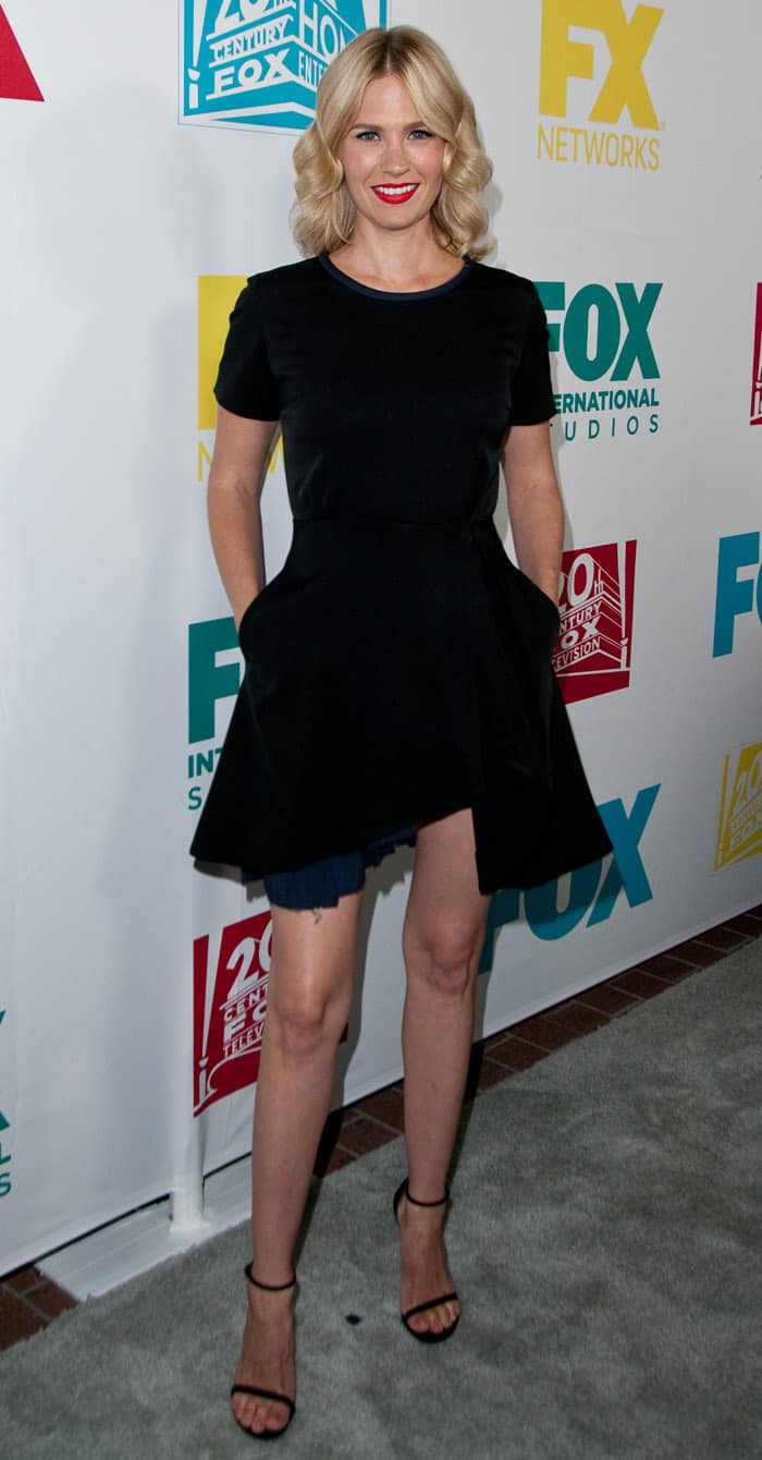January Jones stunned in a unique asymmetrical CG Spring 2014 dress, keeping it chic with Stuart Weitzman “Nudist” sandals in black