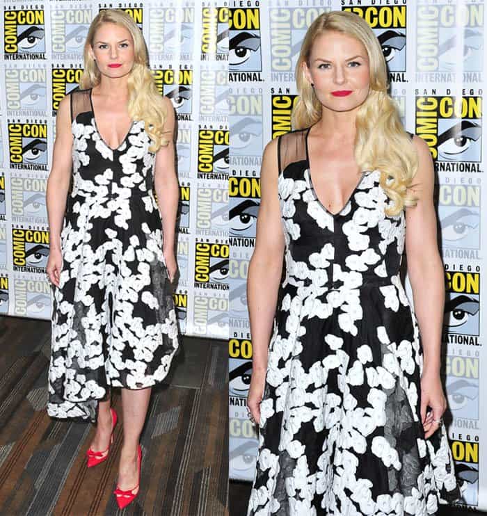 Jennifer Morrison radiated timeless femininity in a black-and-white Lela Rose floral midi dress, adding a vivid pop of color with red Bionda Castana pumps