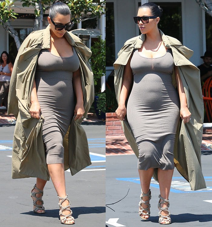 Kim squeezed her voluminous figure into a gray skin-tight ribbed dress