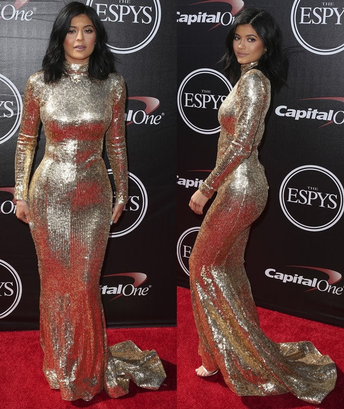 Kylie Jenner turns heads at the 2015 ESPY Awards in a shimmering gold sequined Shady Zeineldine gown, finished with metallic Tamara Mellon sandals that subtly peek out beneath the dramatic hem
