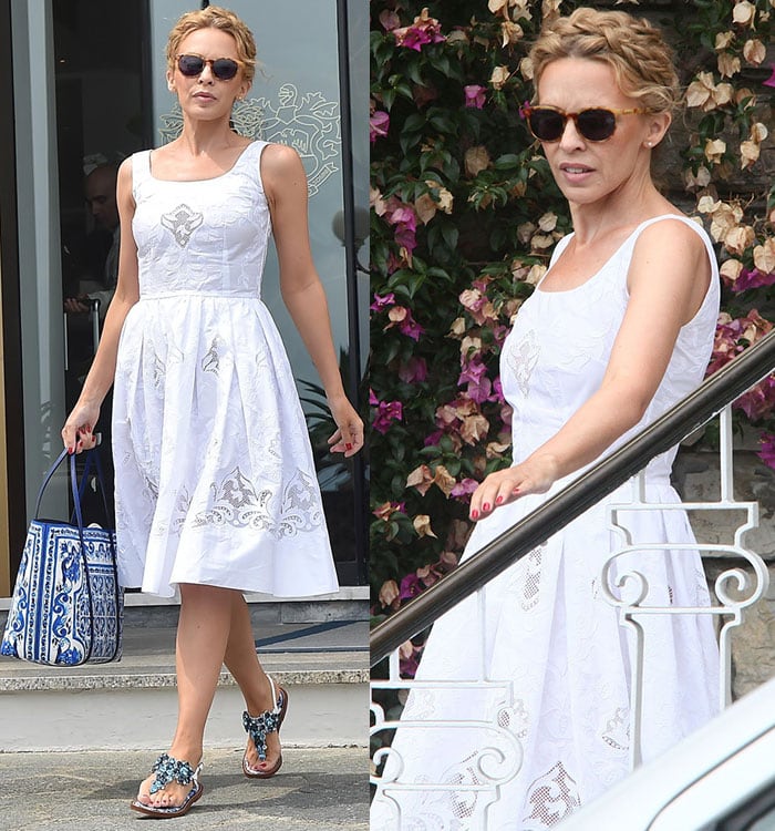 Kylie Minogue showcases her blue-and-white Dolce  Gabbana look as she boards a yacht