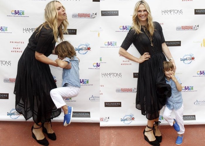 Molly Sims shares a playful moment with her son Brooks while posing on the red carpet in her chic black ensemble