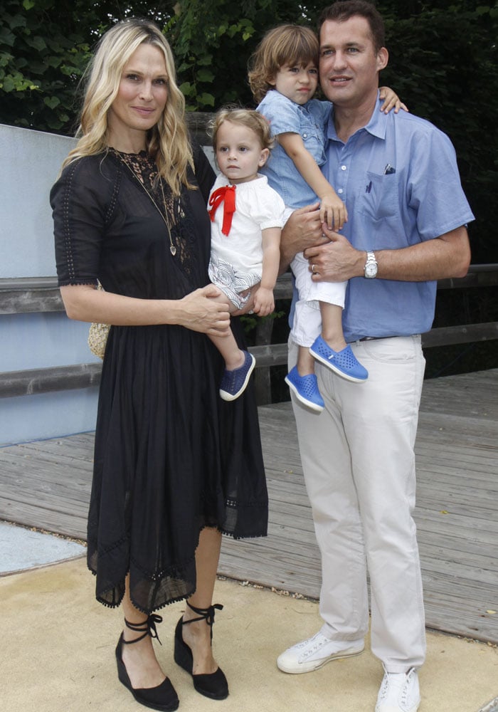 Molly Sims poses with her husband Scott Stuber and their children, all coordinating in breezy summer neutrals