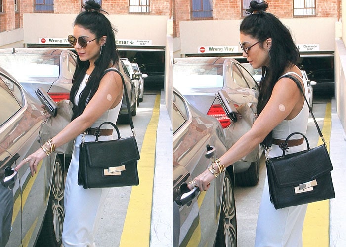 Vanessa Hudgens steps out in Beverly Hills on July 23, 2015, styling a white midi dress with Koolaburra “Alexa” sandals, a Vita Fede Titan crystal ring necklace, and a Hermès Constance belt for an effortlessly polished boho look