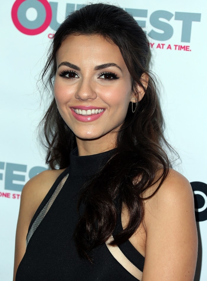 Victoria Justice beams with elegance at the premiere of Naomi Ely's No Kiss List during the 2015 Outfest LGBT Los Angeles Film Festival, showcasing her radiant smile and flawless makeup